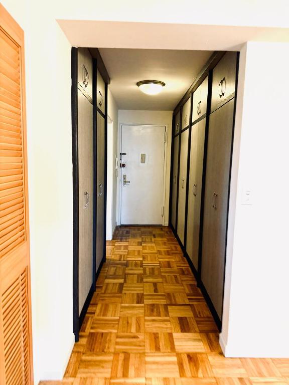 corridor with dark parquet flooring