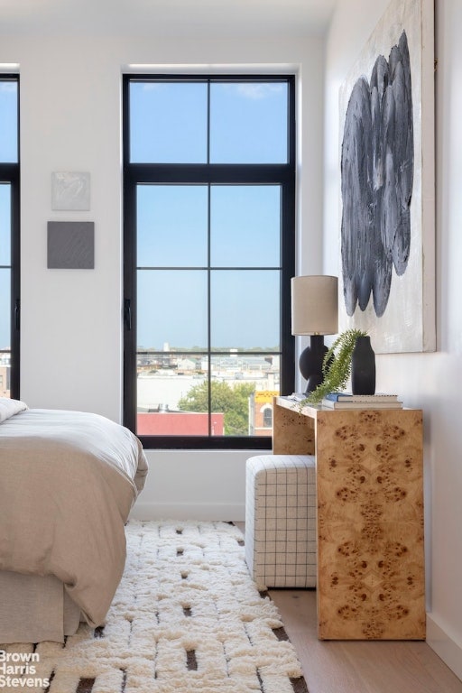 bedroom with light hardwood / wood-style floors