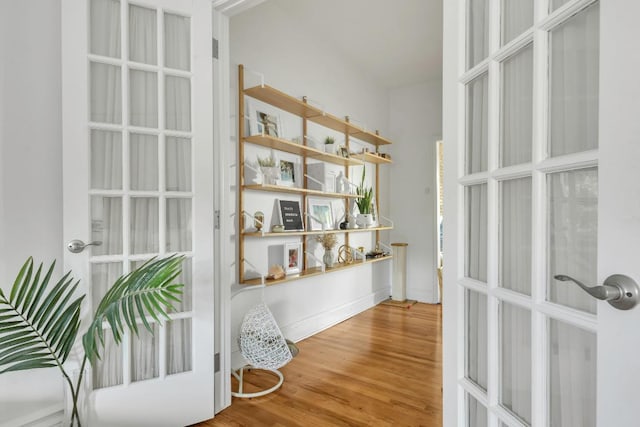 interior space featuring hardwood / wood-style floors and french doors