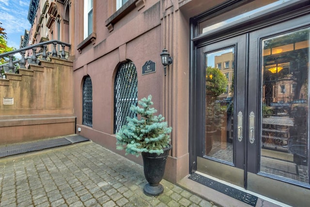 view of exterior entry featuring french doors