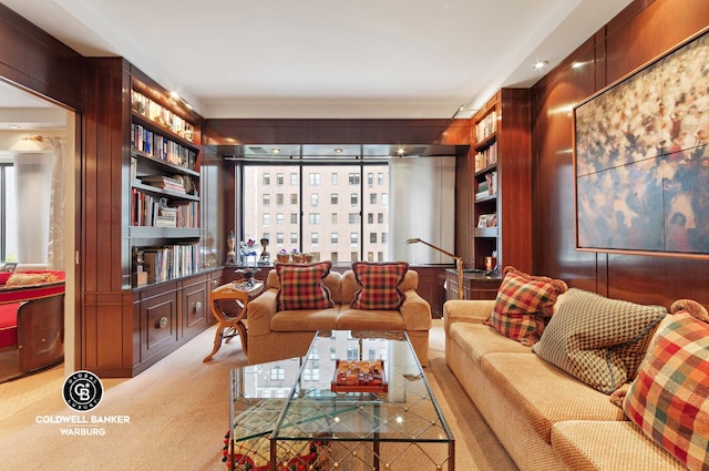 carpeted living room featuring built in shelves