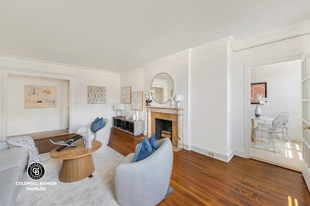 living room with crown molding and dark wood-type flooring