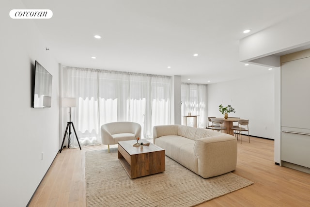 350 W 44th St Unit 101, New York City, NY 10036 - living area with recessed lighting and light wood-style floors