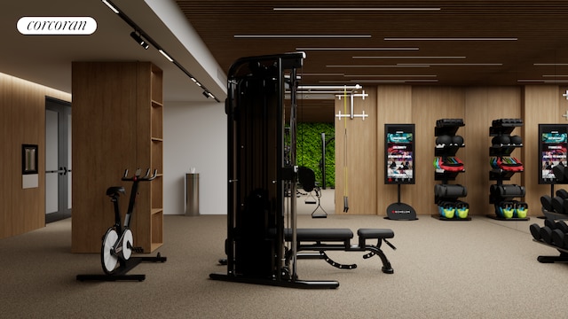 workout area featuring visible vents and wooden walls