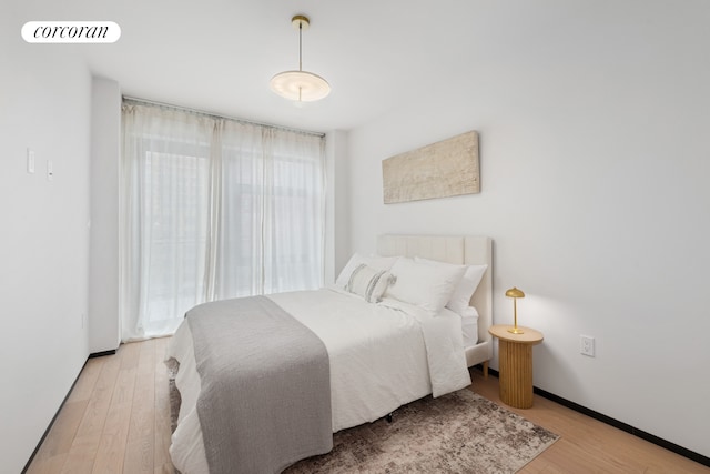 350 W 44th St Unit 101, New York City, NY 10036 - bedroom with wood finished floors