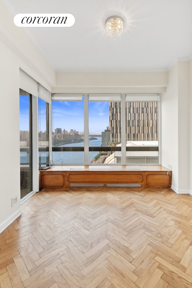 unfurnished sunroom with a city view