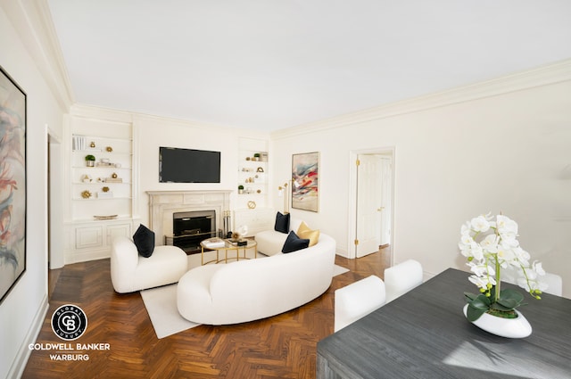 living room featuring crown molding, dark parquet flooring, and built in shelves