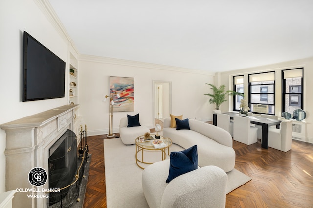 living room featuring dark parquet floors, built in features, and crown molding