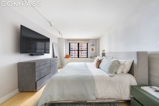 bedroom featuring wood-type flooring