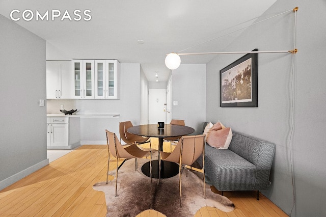 dining space featuring light hardwood / wood-style floors