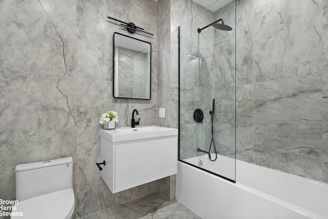 full bathroom featuring vanity, bath / shower combo with glass door, and toilet