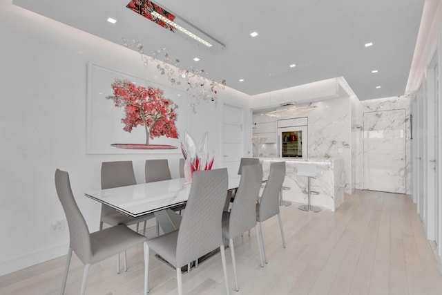 dining area with light hardwood / wood-style floors