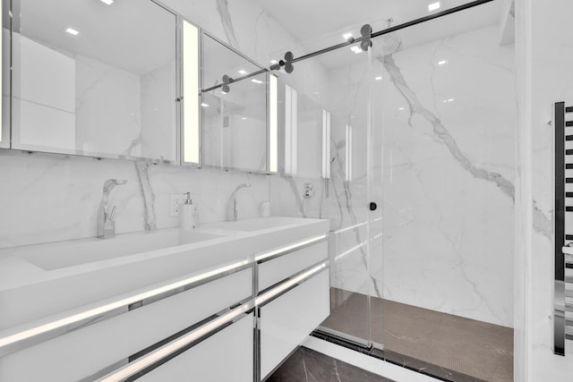 200 E 69th St Unit 31-A, New York City, NY 10021 - bathroom featuring a marble finish shower, double vanity, and marble finish floors