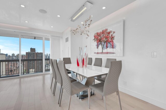 200 E 69th St Unit 31-A, New York City, NY 10021 - dining space with wood finished floors, recessed lighting, and a view of city