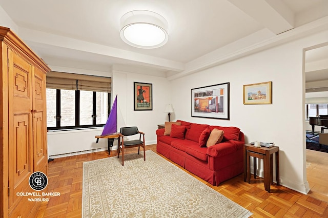 living room with light parquet floors and beamed ceiling