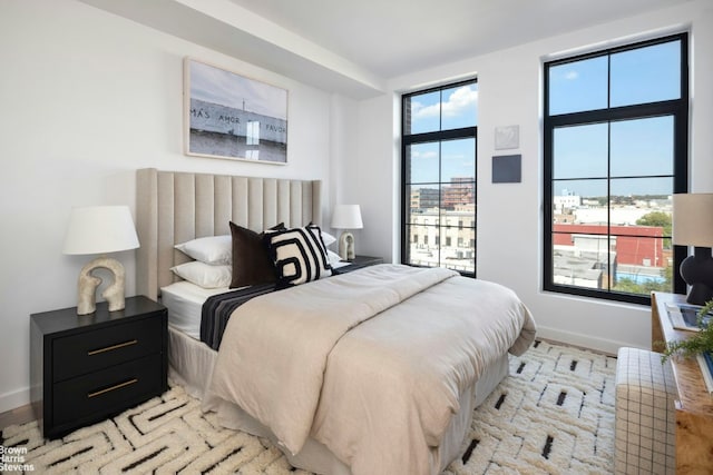 bedroom featuring multiple windows