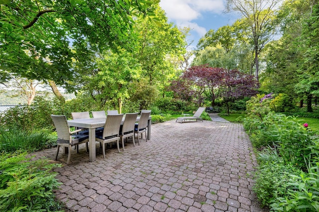2727 Palisade Ave Unit 7-B, New York City, NY 10463 - view of patio with outdoor dining space and view of scattered trees