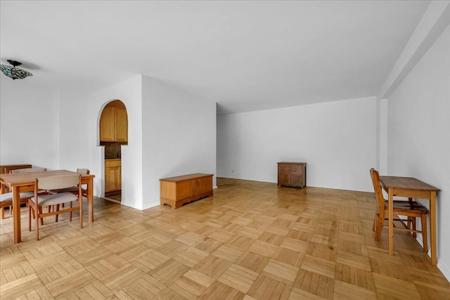 dining room with arched walkways