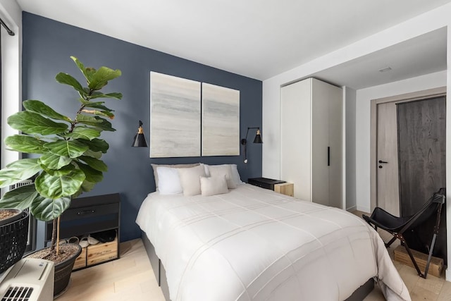 bedroom with light wood-style flooring