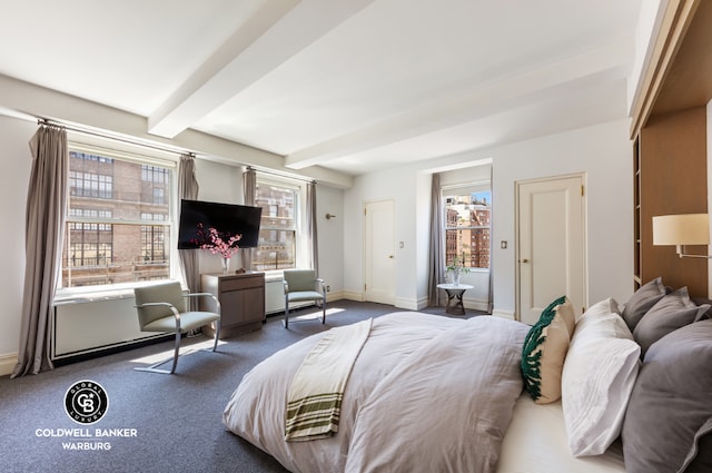 carpeted bedroom with beam ceiling