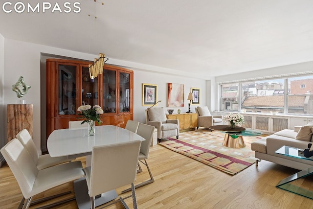 dining space with light wood-type flooring