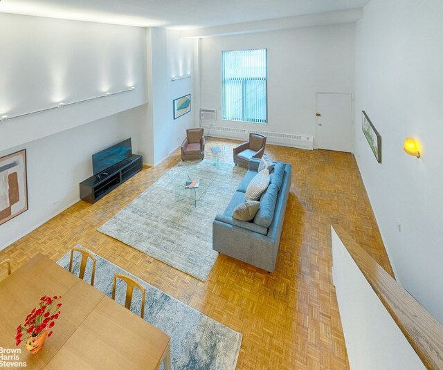 living room featuring light parquet flooring