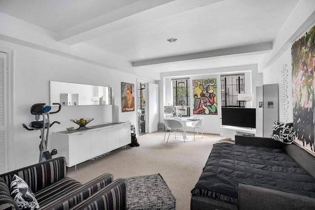 bedroom with beamed ceiling and light carpet