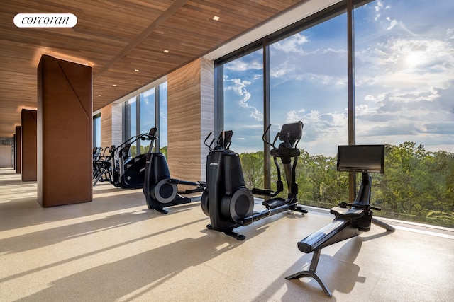 workout area with wood ceiling, expansive windows, and recessed lighting