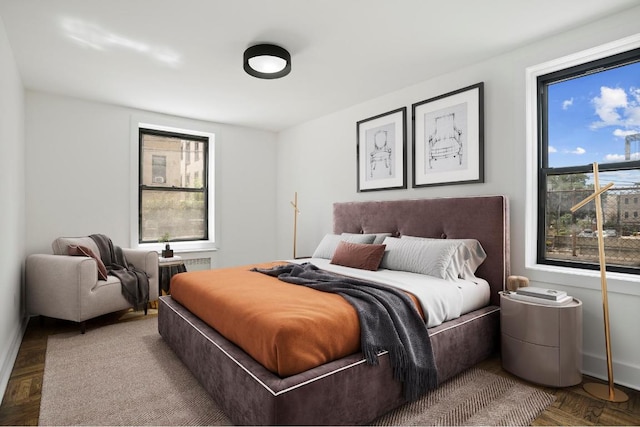 bedroom with radiator and parquet floors