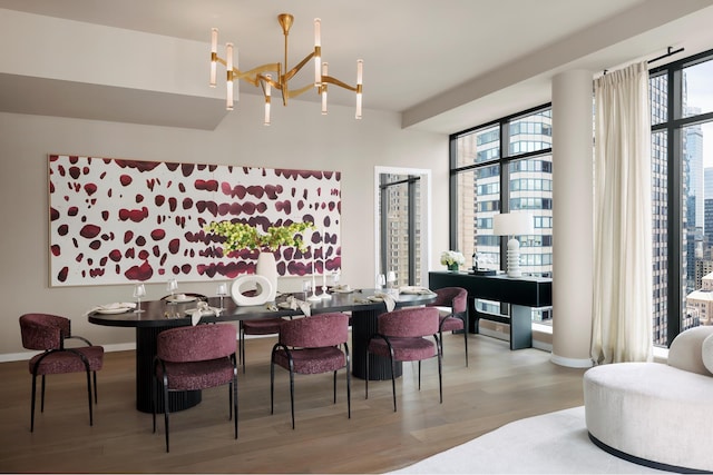 111 W 56th St Phc, Phc, New York City, NY 10019 - dining area featuring a notable chandelier, baseboards, and wood finished floors
