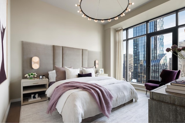 111 W 56th St Phc, Phc, New York City, NY 10019 - bedroom with light wood-style flooring, track lighting, baseboards, and a view of city