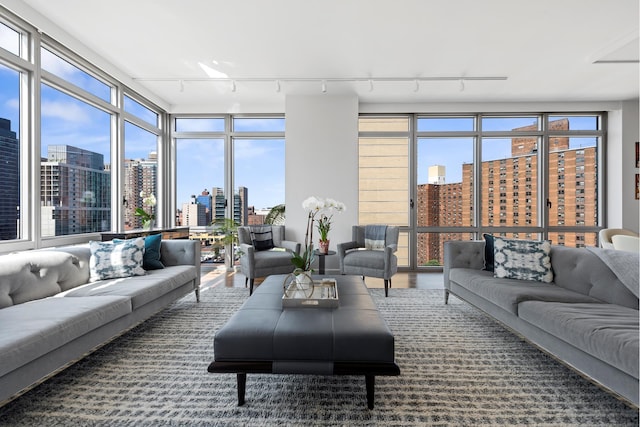 living room with a view of city and track lighting