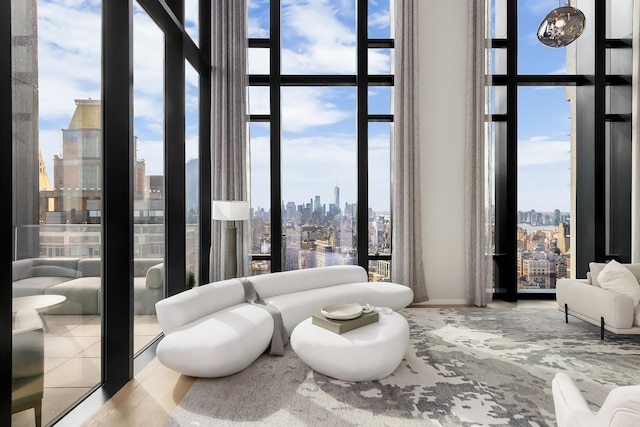 interior space with a view of city and expansive windows