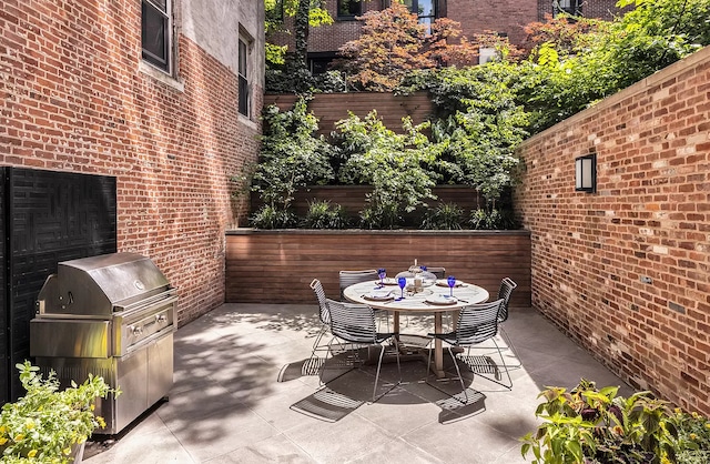 view of patio / terrace with outdoor dining area and area for grilling