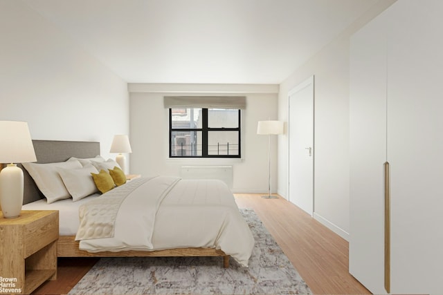 bedroom featuring wood-type flooring