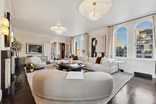 living area featuring a chandelier and ornamental molding