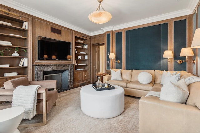 living room featuring crown molding, built in features, visible vents, and a high end fireplace