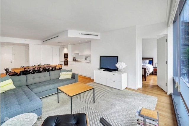 living area featuring light wood-style flooring