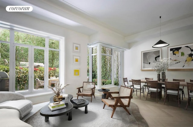 sitting room with crown molding and parquet flooring