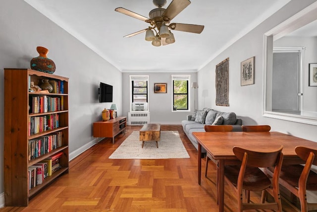 dining area with ceiling fan and light parquet flooring