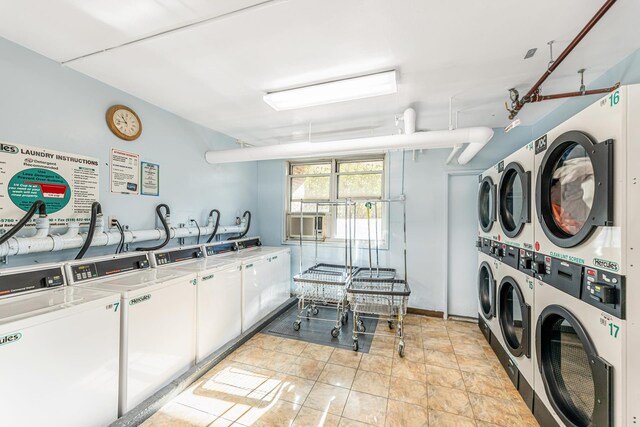 clothes washing area featuring stacked washer / dryer and washing machine and clothes dryer