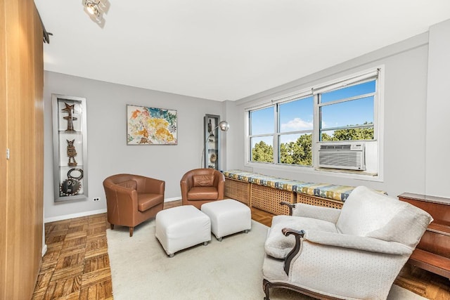 living area featuring cooling unit and parquet flooring