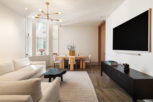 49 Chambers St Unit 10B, New York City, NY 10007 - living area with recessed lighting, dark wood finished floors, and an inviting chandelier