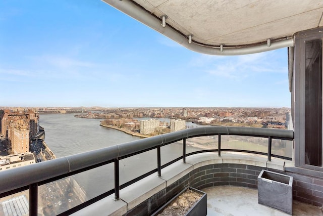 balcony featuring a water view