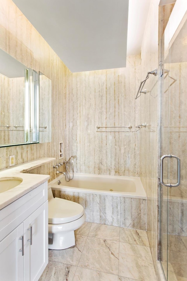 full bathroom featuring vanity, a tile shower, a relaxing tiled tub, tile walls, and toilet