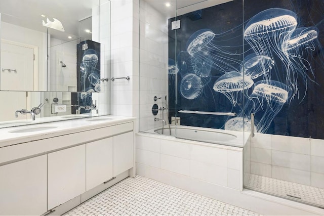 bathroom featuring vanity, tile patterned flooring, and combined bath / shower with glass door