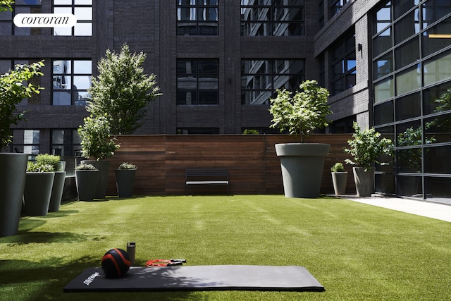 view of home's community featuring a lawn