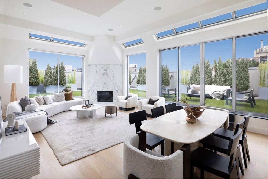 sunroom / solarium with a fireplace