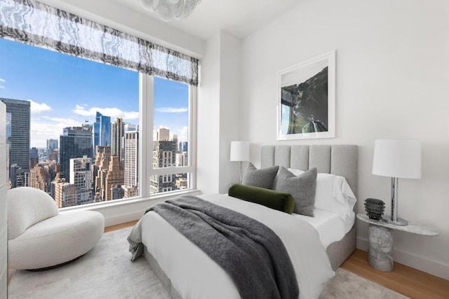 bedroom with hardwood / wood-style floors