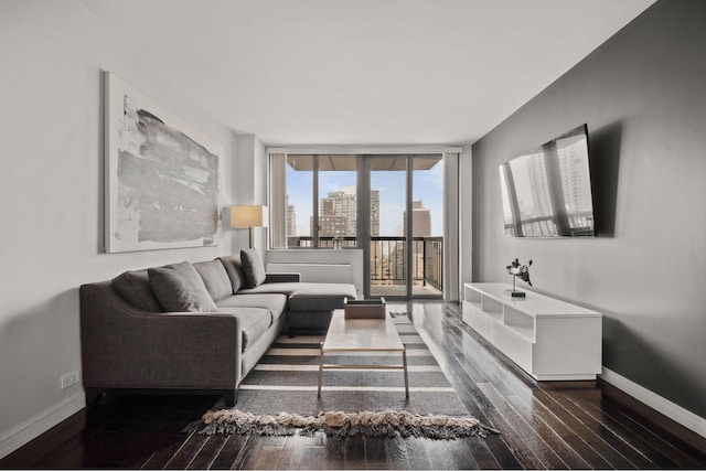 300 E 54th St Unit 26C, New York City, NY 10022 - living room with hardwood / wood-style flooring, baseboards, and expansive windows